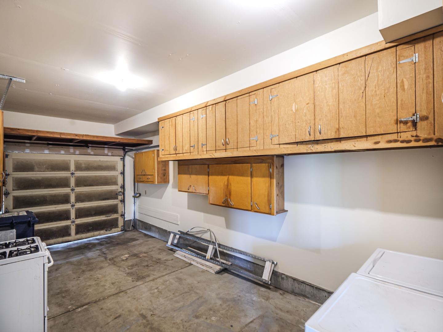 216 Silver Leaf Drive, Unit C Watsonville, CA 95076 - Photo 25 of 36 a storage room with wooden cabinets