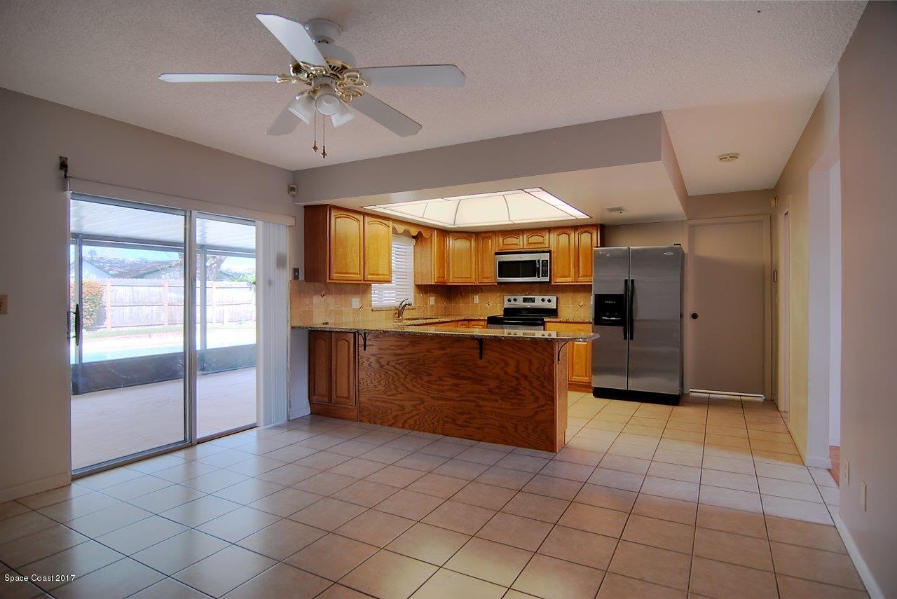 1970 Tallpine Road Melbourne, FL 32935 - Photo 4 of 14 Family Room to the Kitchen