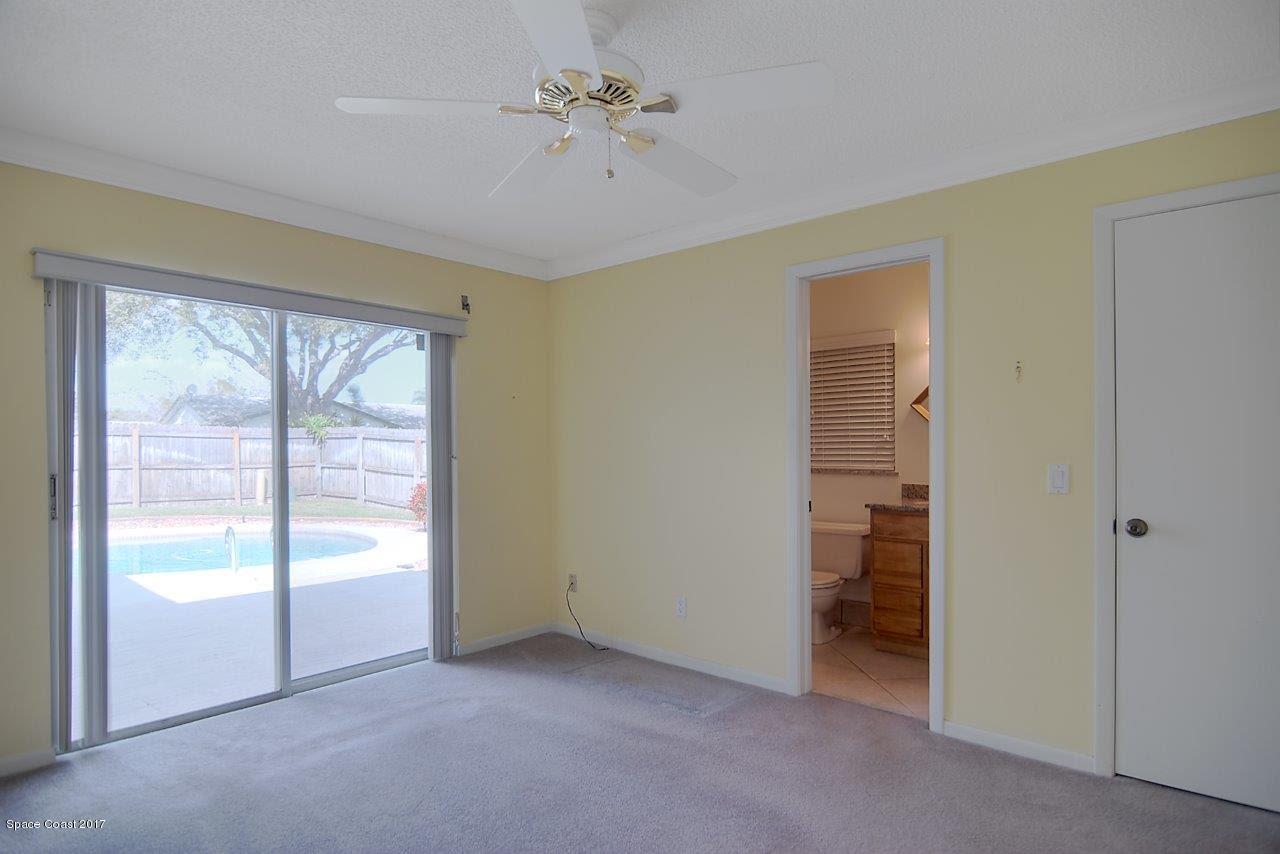 1970 Tallpine Road Melbourne, FL 32935 - Photo 6 of 14 Master Bedroom with Sliders to the Pool