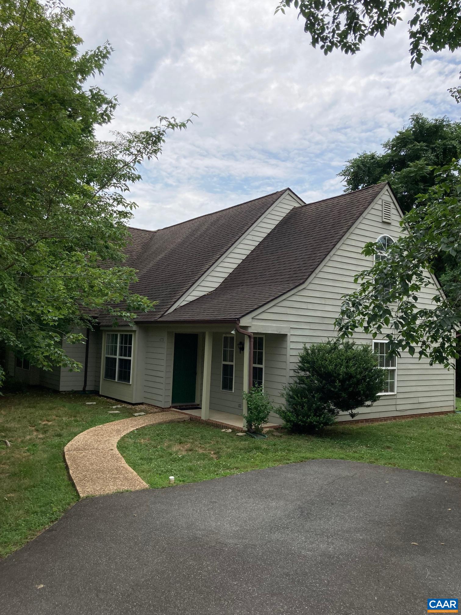 a view of house with a yard