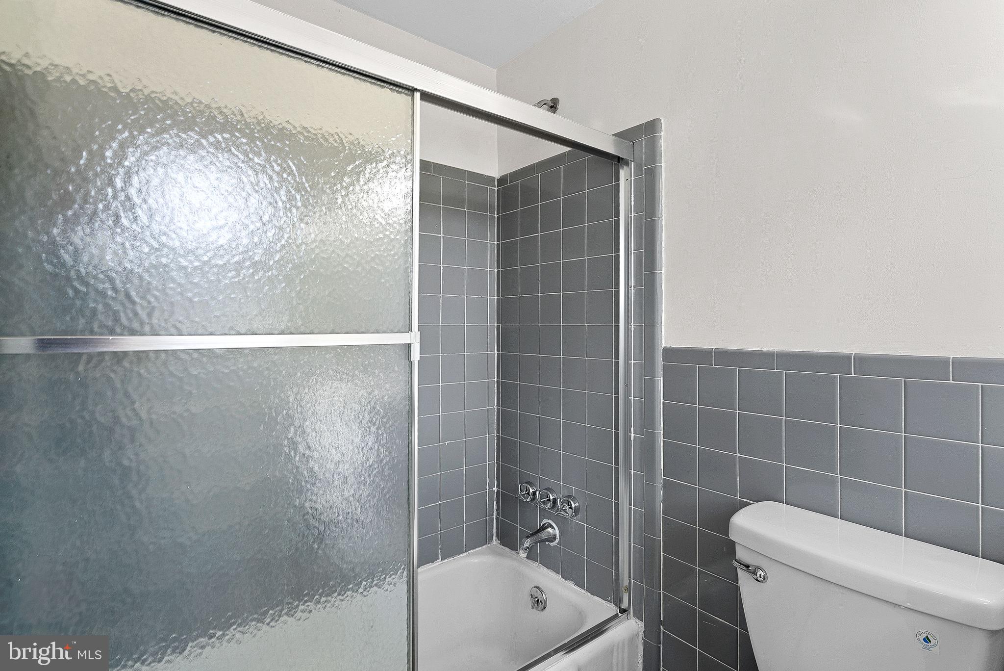 10021 Glenmere Road Fairfax, VA 22032 - Photo 22 of 45 a bathroom with a toilet and shower