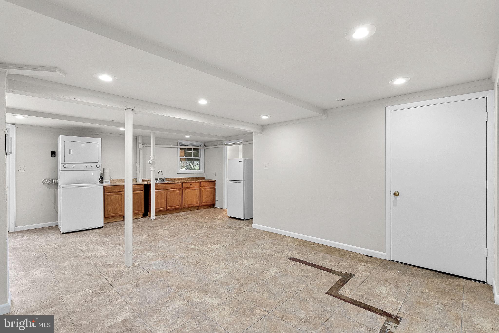 10021 Glenmere Road Fairfax, VA 22032 - Photo 29 of 45 a view of kitchen with refrigerator and white cabinets