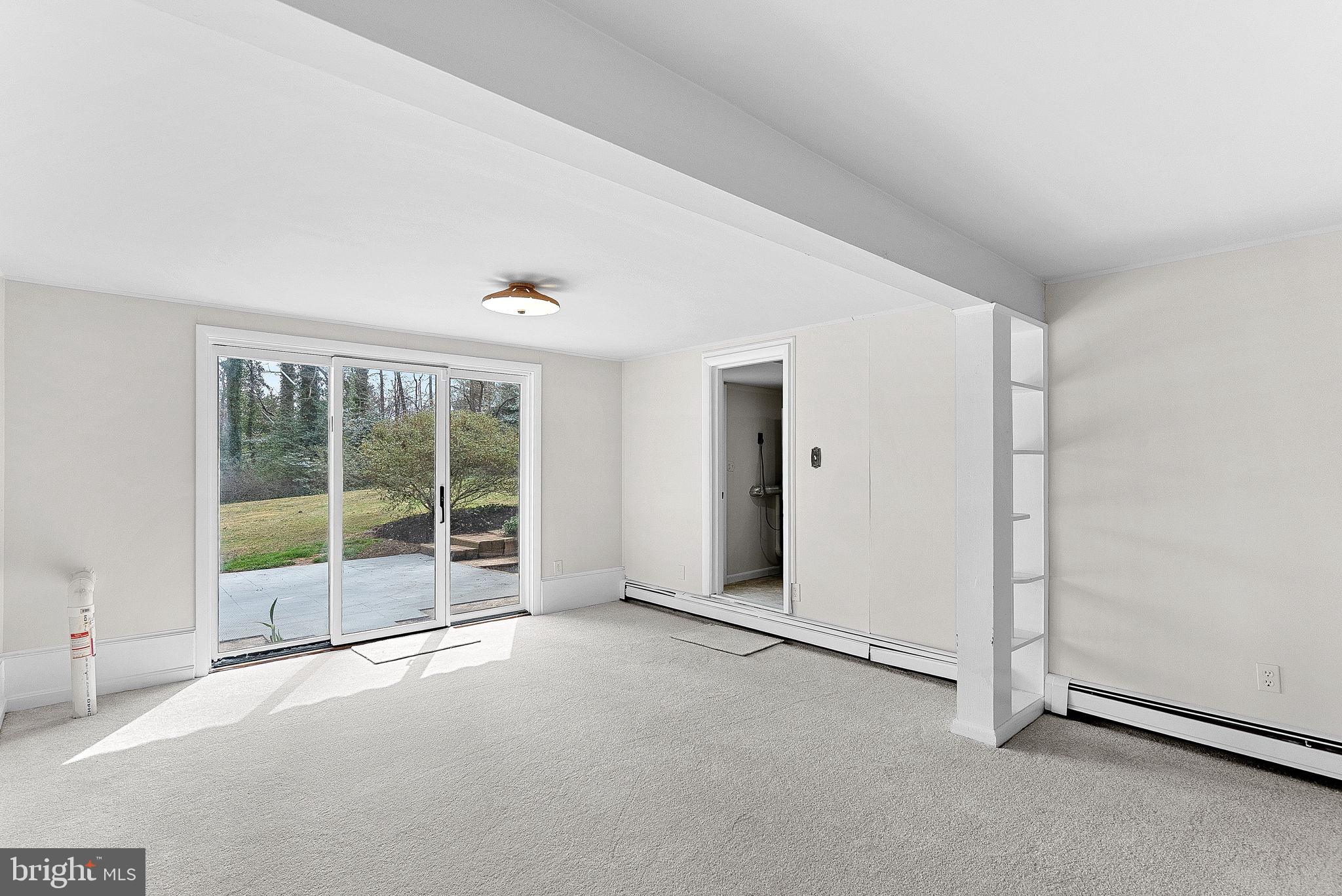 10021 Glenmere Road Fairfax, VA 22032 - Photo 32 of 45 an empty room with a sliding door