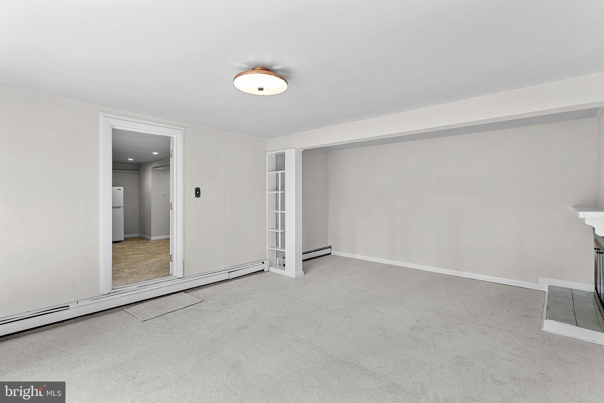 10021 Glenmere Road Fairfax, VA 22032 - Photo 34 of 45 an empty room with sliding door