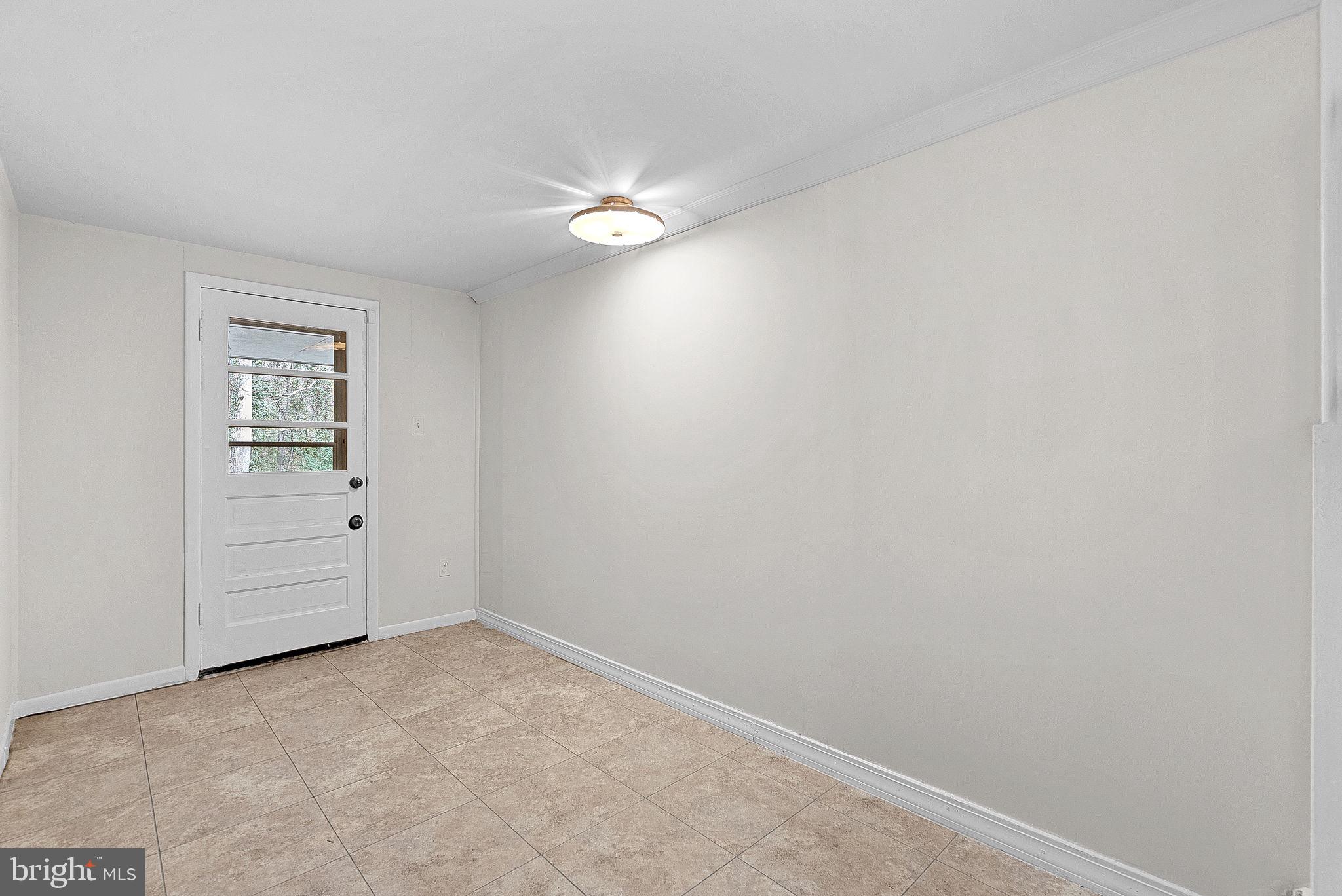 10021 Glenmere Road Fairfax, VA 22032 - Photo 36 of 45 an empty room with closet and a chandelier fan