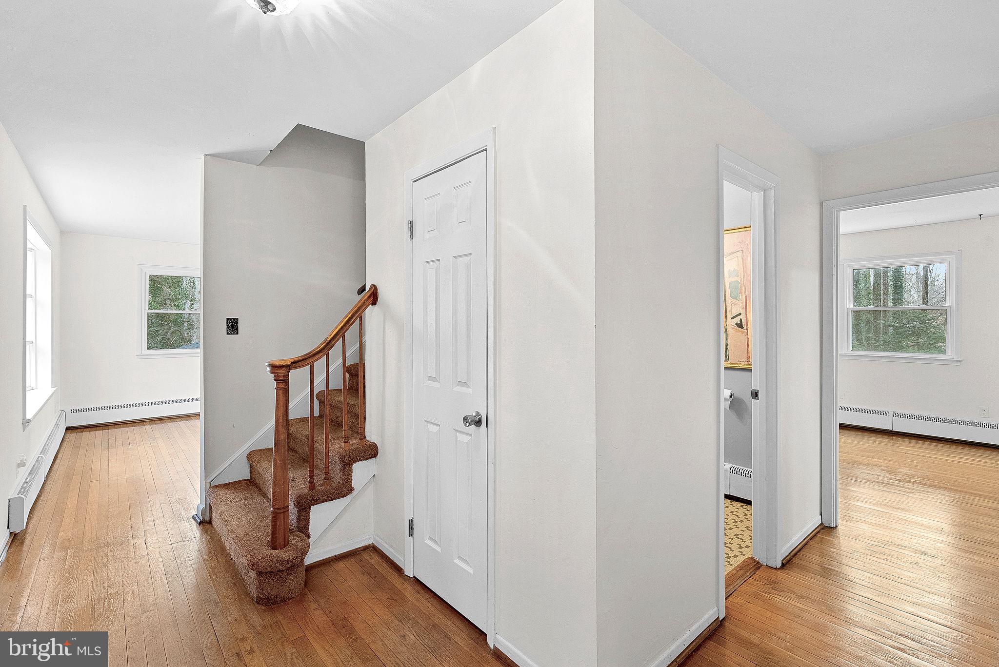 10021 Glenmere Road Fairfax, VA 22032 - Photo 4 of 45 a view of entryway with wooden floor and stairs