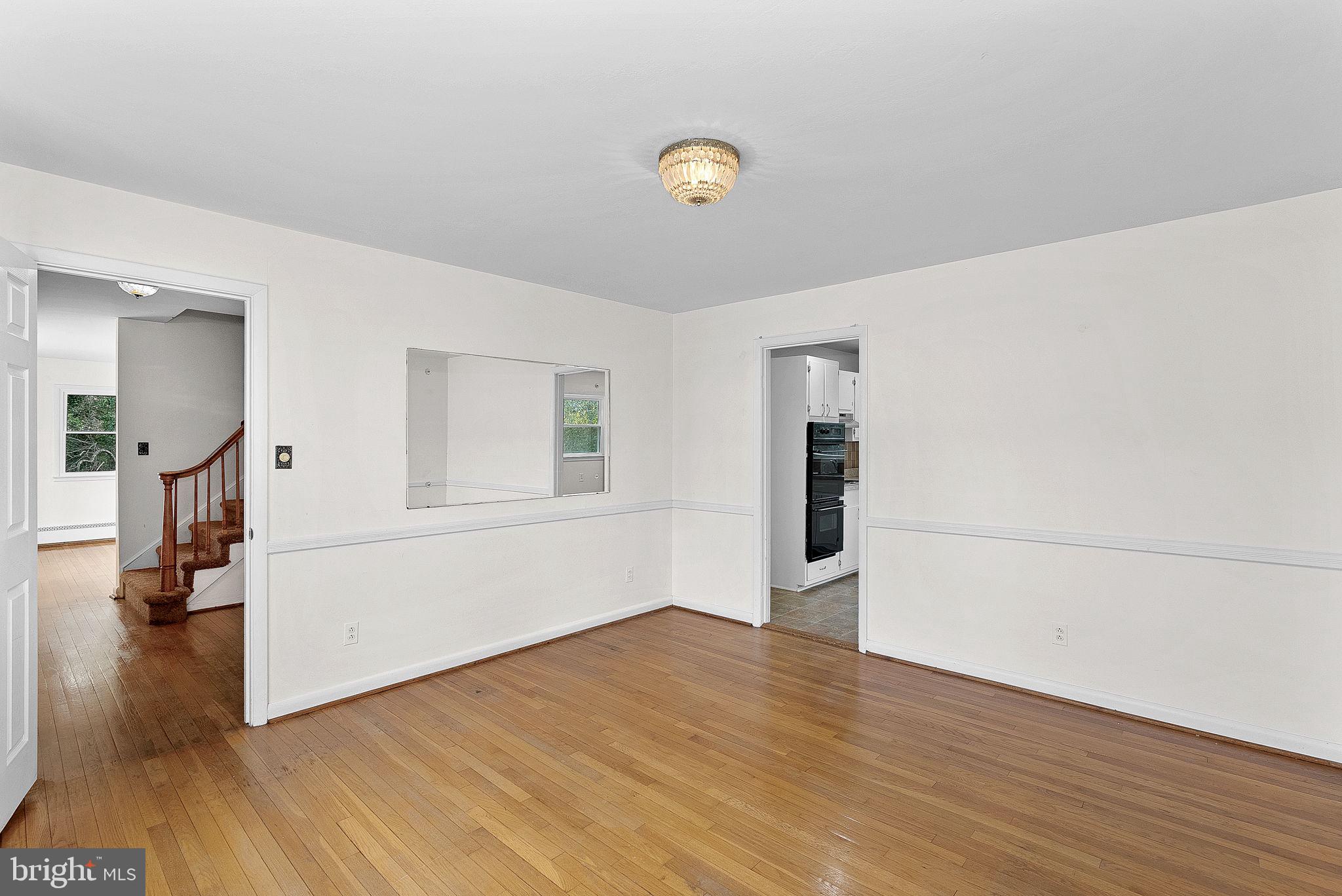 10021 Glenmere Road Fairfax, VA 22032 - Photo 10 of 45 a view of empty room with wooden floor
