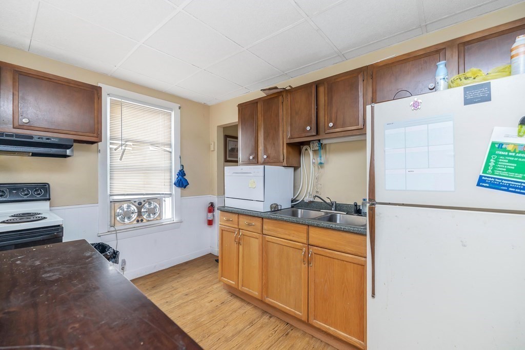 591 Grattan Street Chicopee, MA 01020 - Photo 19 of 36 a kitchen with stainless steel appliances granite countertop a refrigerator sink and cabinets