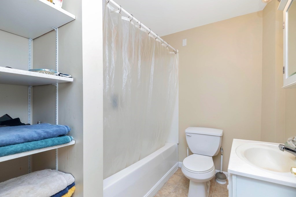 591 Grattan Street Chicopee, MA 01020 - Photo 20 of 36 a bathroom with a toilet a sink and bathtub