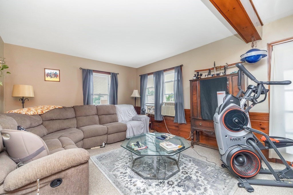 591 Grattan Street Chicopee, MA 01020 - Photo 23 of 36 a living room with furniture and a wooden floor