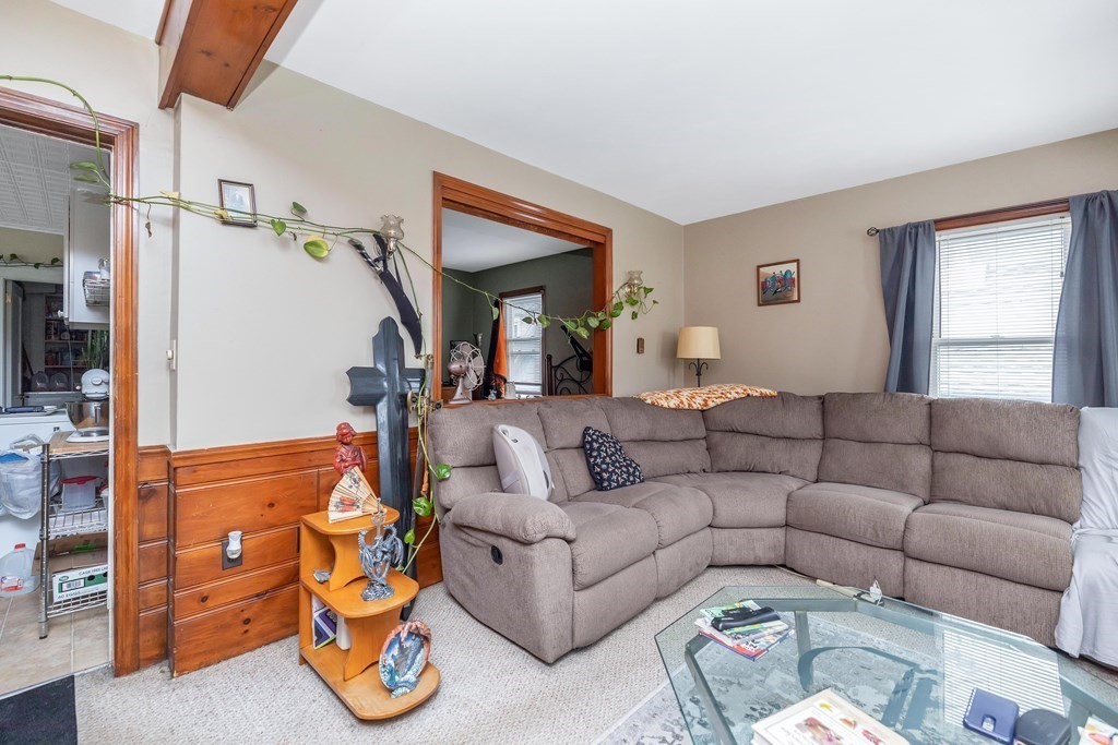 591 Grattan Street Chicopee, MA 01020 - Photo 26 of 36 a living room with furniture and a flat screen tv