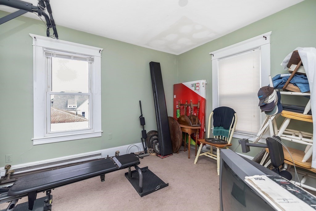 591 Grattan Street Chicopee, MA 01020 - Photo 27 of 36 a view of a workspace with furniture and a window
