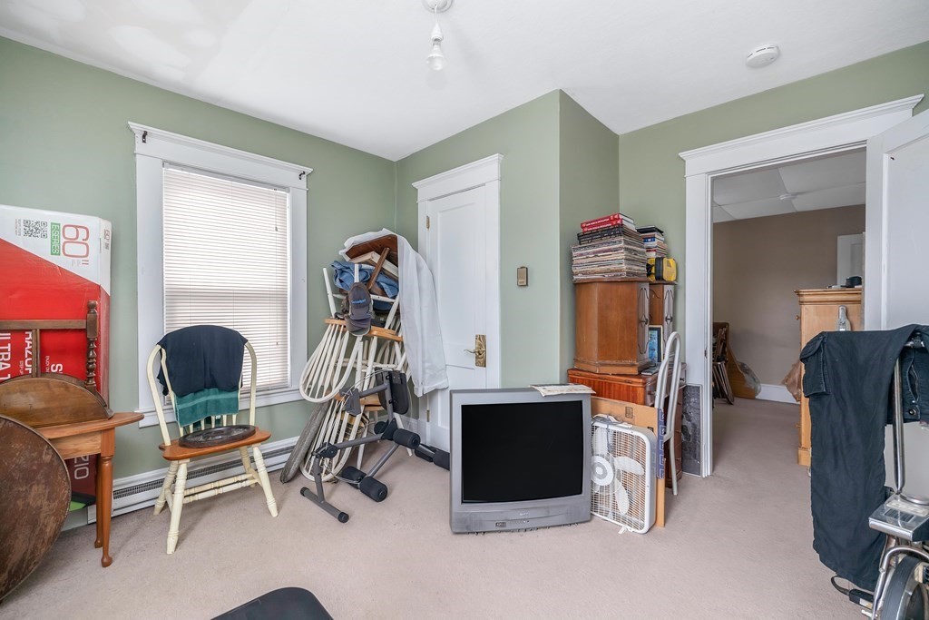 591 Grattan Street Chicopee, MA 01020 - Photo 28 of 36 a room with furniture a rug and gym equipment