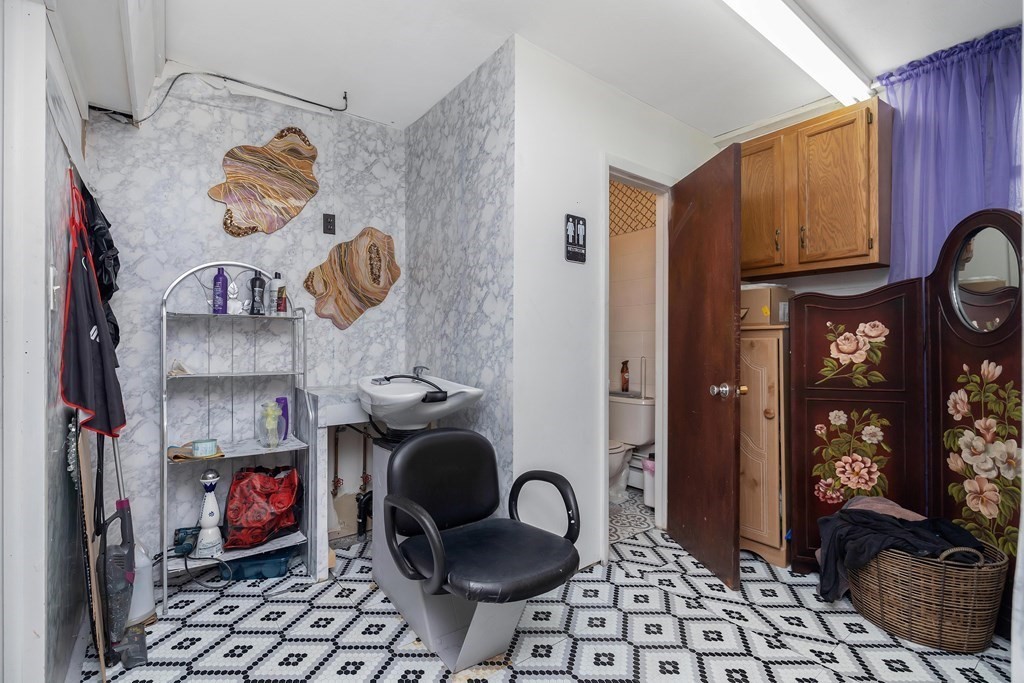 591 Grattan Street Chicopee, MA 01020 - Photo 36 of 36 a table chair in a room and a mirror