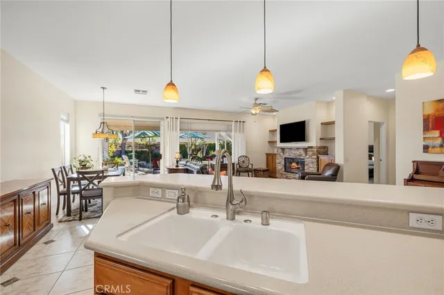 a view of a kitchen with furniture and a flat screen tv