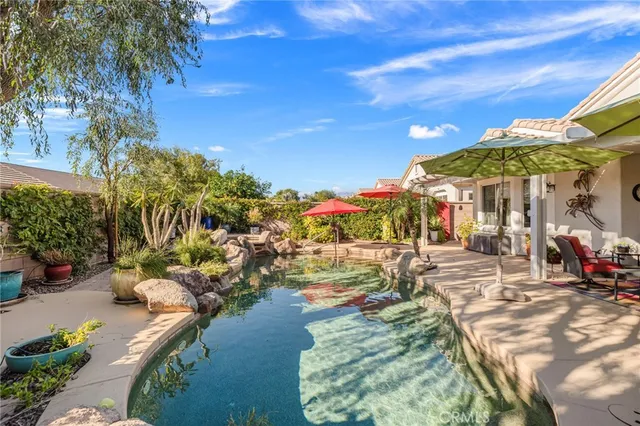a view of swimming pool with outdoor seating