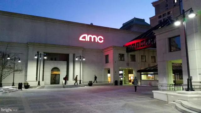 a view of a building with retail shops