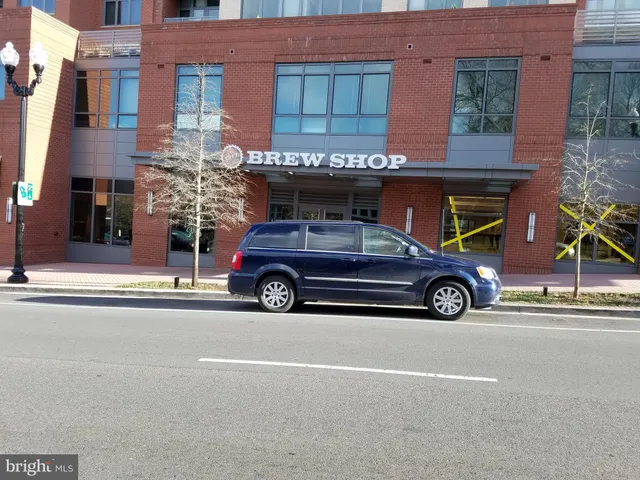 a view of a car parked in front of a building