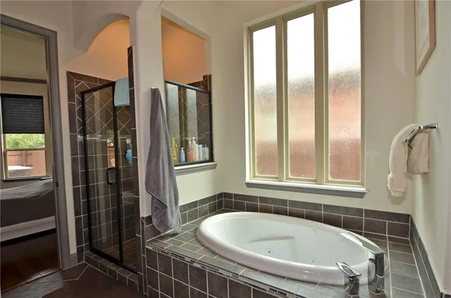 a bathroom with a tub and a sink