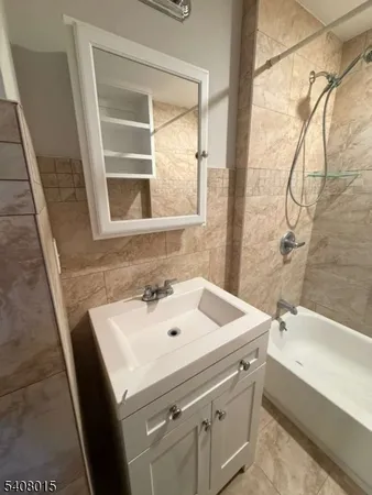 a bathroom with a sink and a bathtub