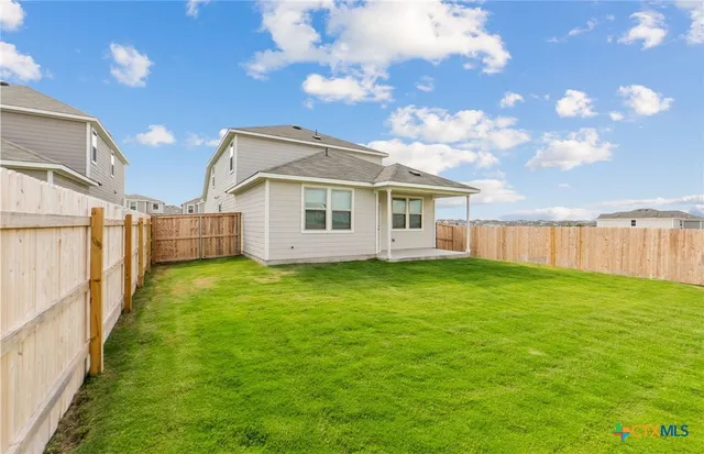 a view of a backyard with a garden