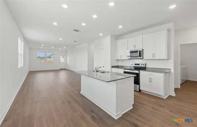 a picture of a bathroom with a sink and a mirror