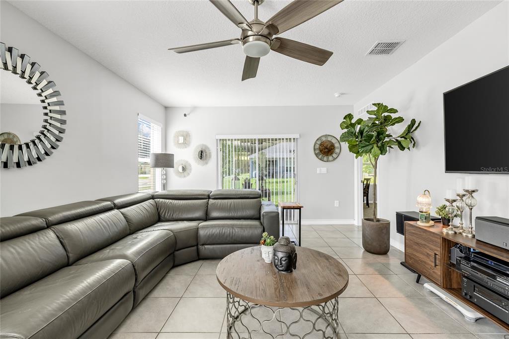 115 Duchess Road DeLand, FL 32724 - Photo 14 of 37 a living room with furniture and a flat screen tv