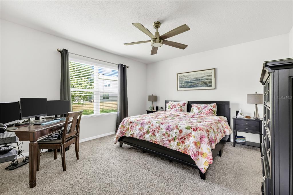 115 Duchess Road DeLand, FL 32724 - Photo 15 of 37 a bedroom with a bed and a window