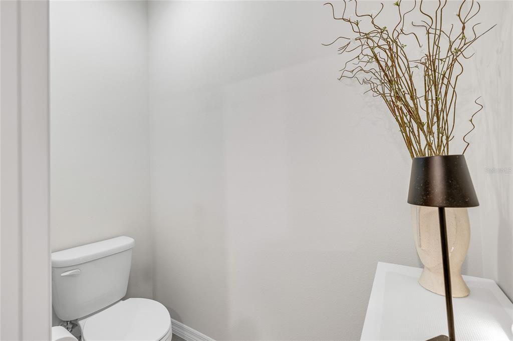 115 Duchess Road DeLand, FL 32724 - Photo 19 of 37 a white toilet sitting next to a shower curtain