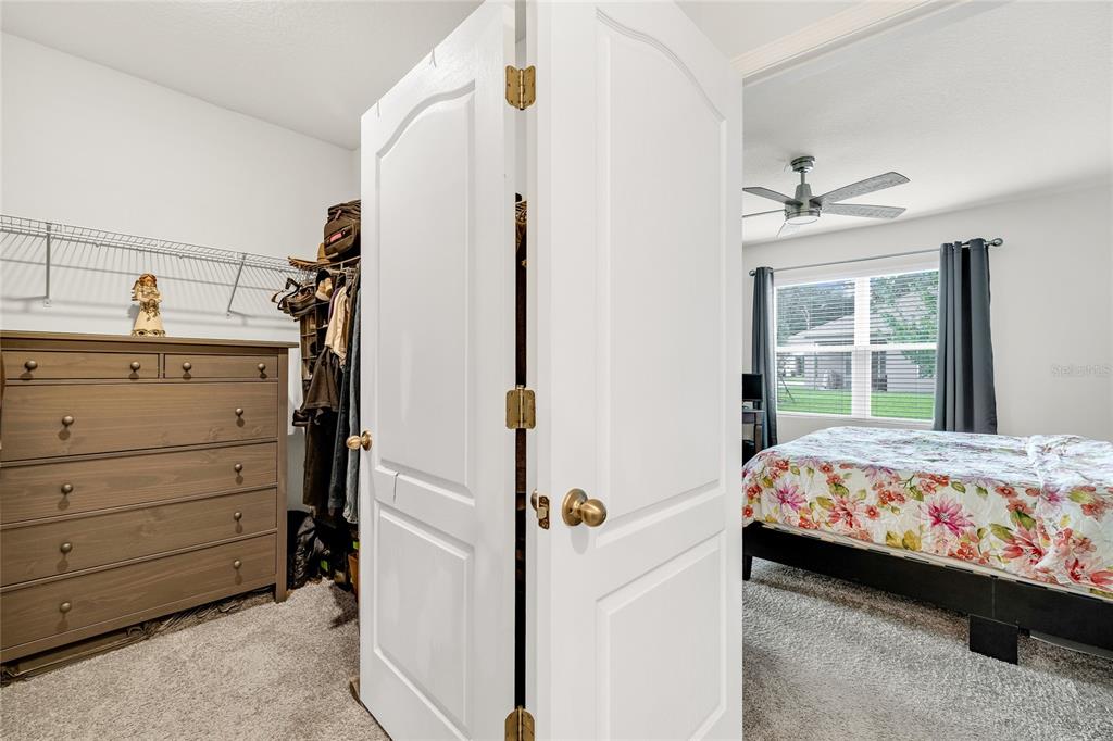 115 Duchess Road DeLand, FL 32724 - Photo 21 of 37 a bedroom with a bed and a window