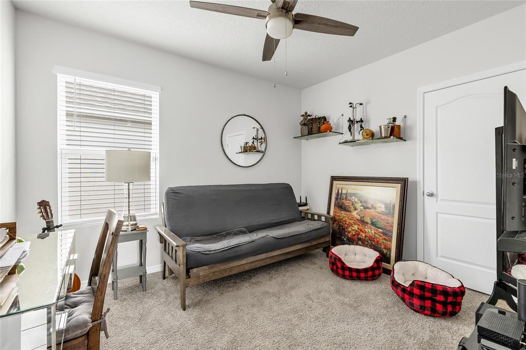 115 Duchess Road DeLand, FL 32724 - Photo 22 of 37 a living room with furniture a air conditioner and a window