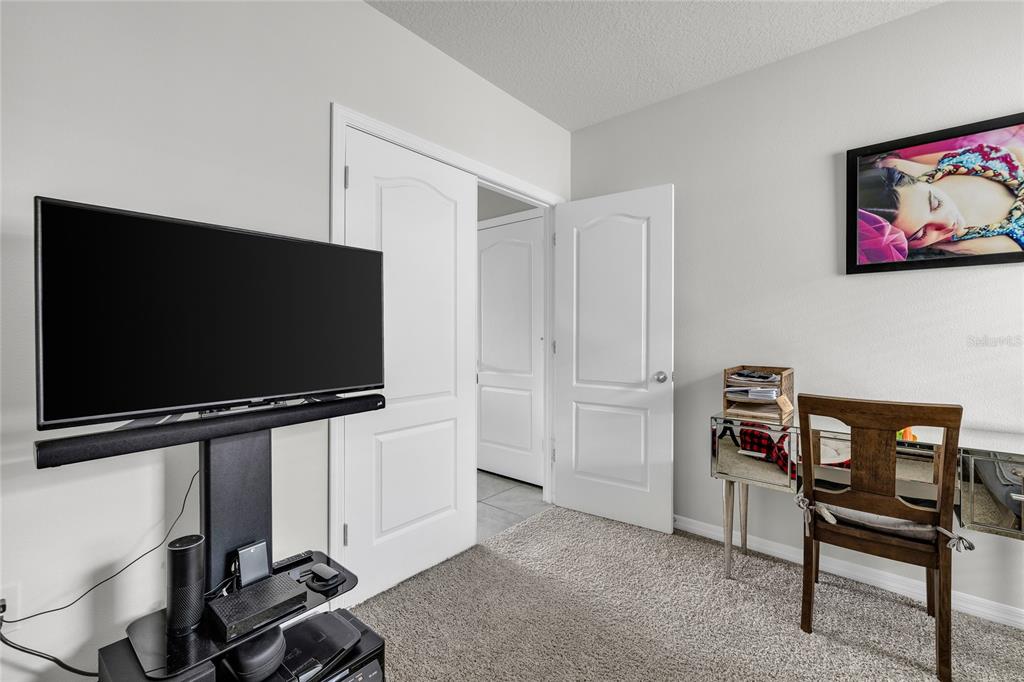 115 Duchess Road DeLand, FL 32724 - Photo 23 of 37 a living room with furniture and a flat screen tv