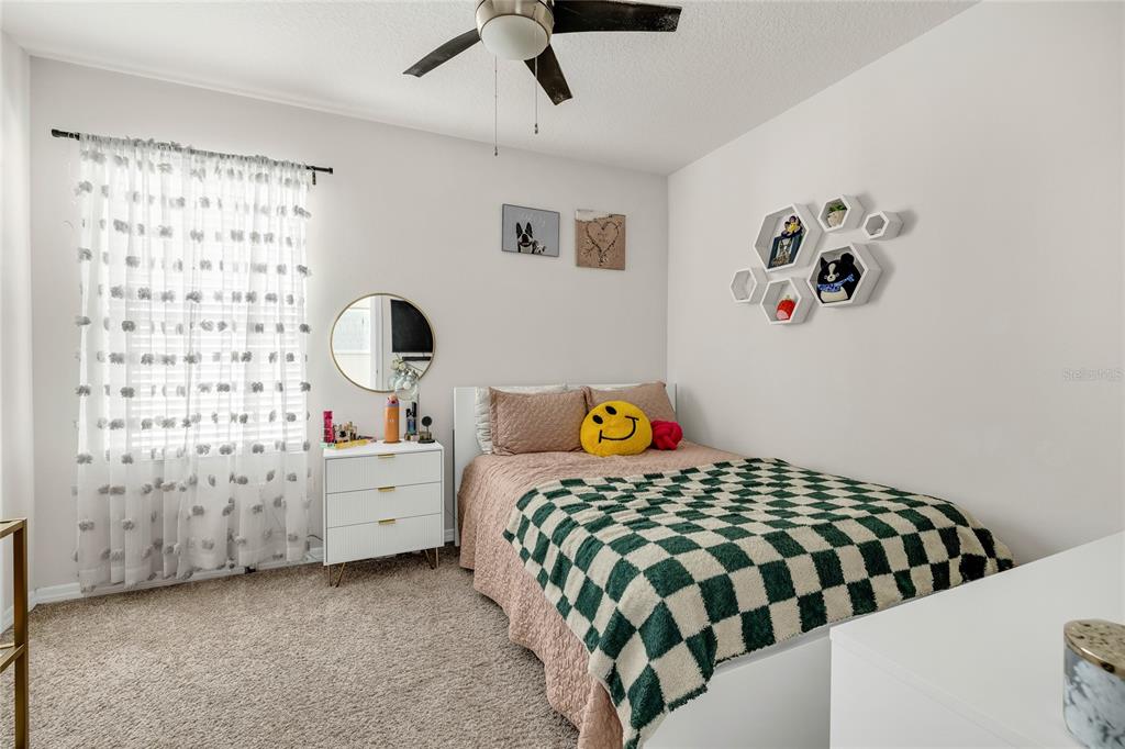 115 Duchess Road DeLand, FL 32724 - Photo 27 of 37 a bedroom with a bed and a window