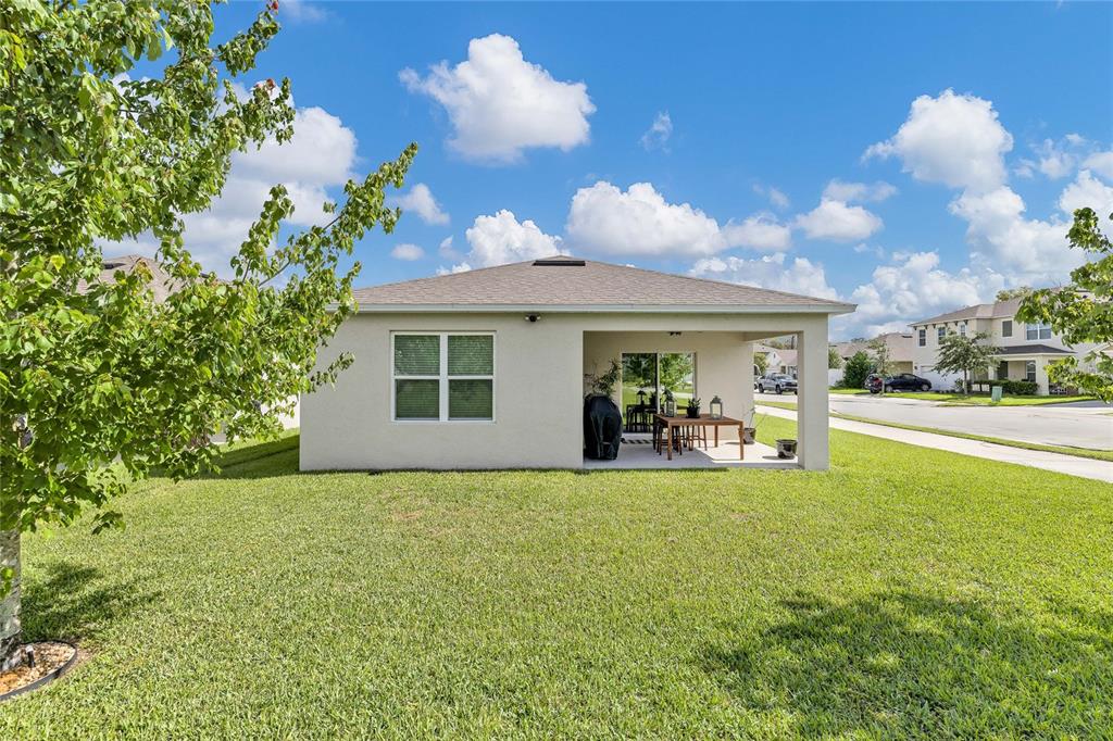115 Duchess Road DeLand, FL 32724 - Photo 33 of 37 a view of a house with backyard porch and sitting area