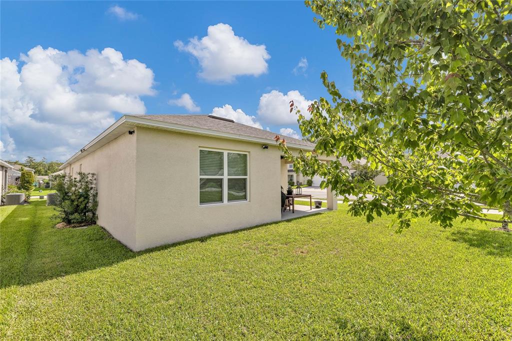 115 Duchess Road DeLand, FL 32724 - Photo 34 of 37 a view of a house with backyard and garden