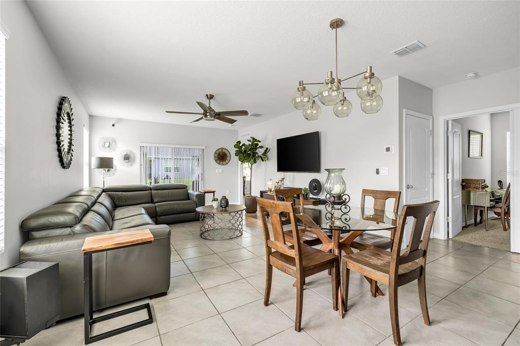 115 Duchess Road DeLand, FL 32724 - Photo 10 of 37 a view of a livingroom with furniture and a flat screen tv