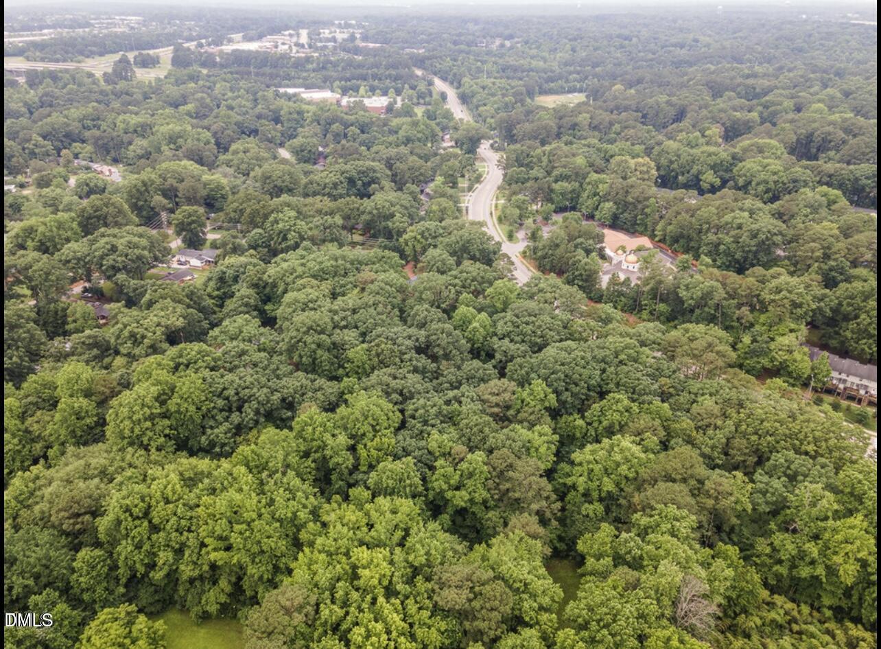517 Buck Jones Road Raleigh, NC 27606 - Photo 5 of 6 an aerial view of residential houses with outdoor space and trees