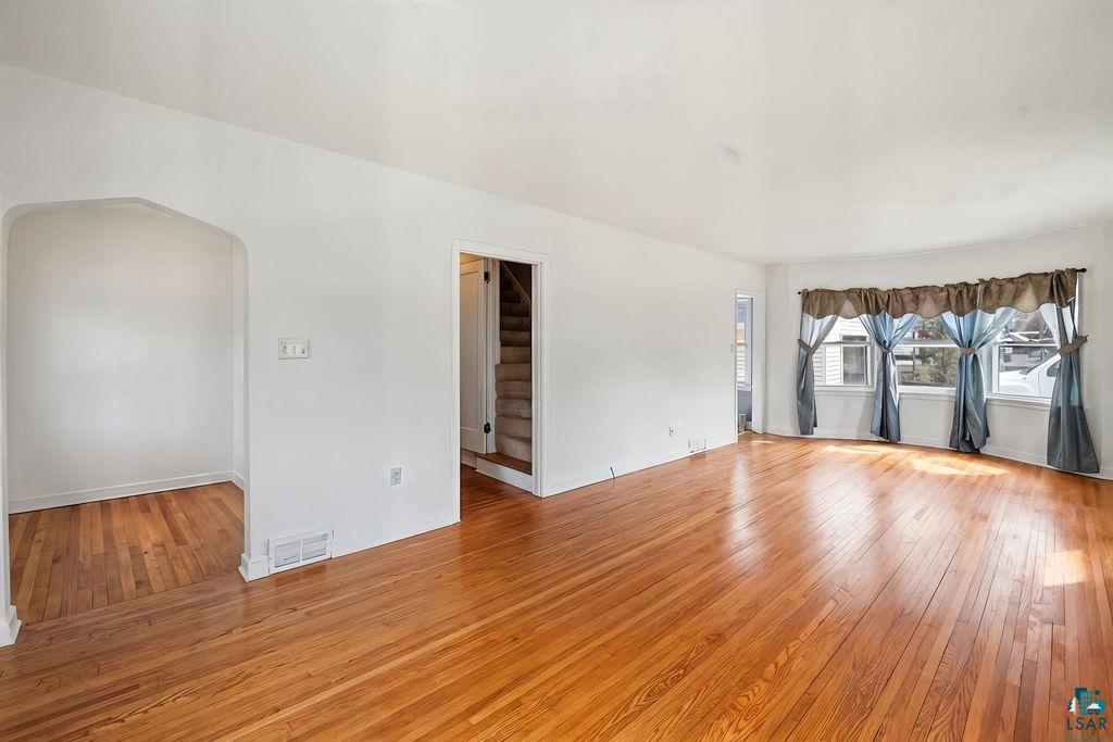 122 3rd Street Cloquet, MN 55720 - Photo 2 of 42 Bright living space featuring natural wood flooring throughout