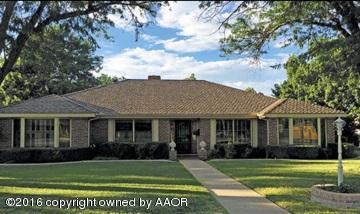6100 Gainsborough Road Amarillo, TX 79106 - Photo 1 of 1 a front view of a house with a garden