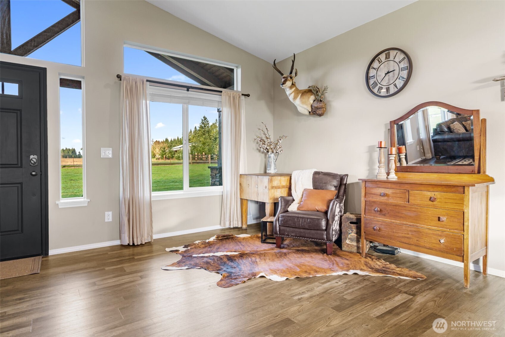 107 Haight Road Chehalis, WA 98532 - Photo 5 of 39 a living room with furniture a clock and a window