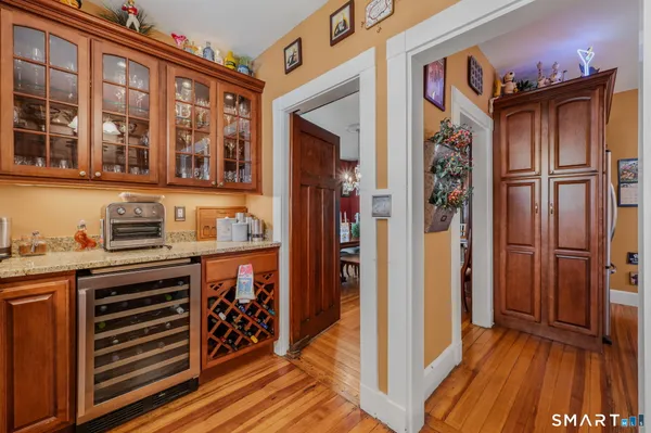 a kitchen with stainless steel appliances granite countertop a refrigerator and a stove