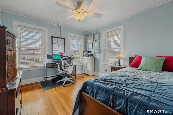 a bedroom with a bed furniture and a window