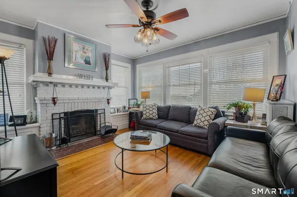 a living room with furniture and a fireplace