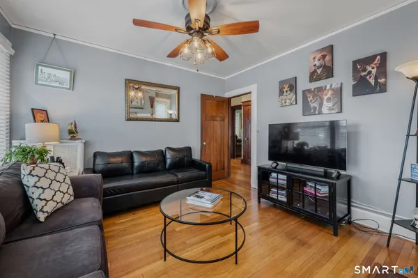 a living room with furniture and a flat screen tv