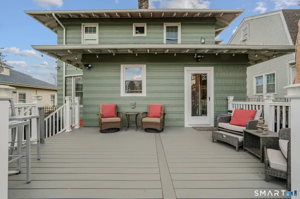a view of a house with a patio and a couch
