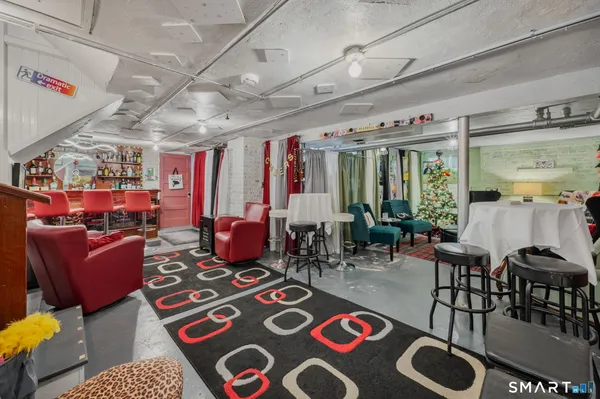a living room with lots of furniture and a rug