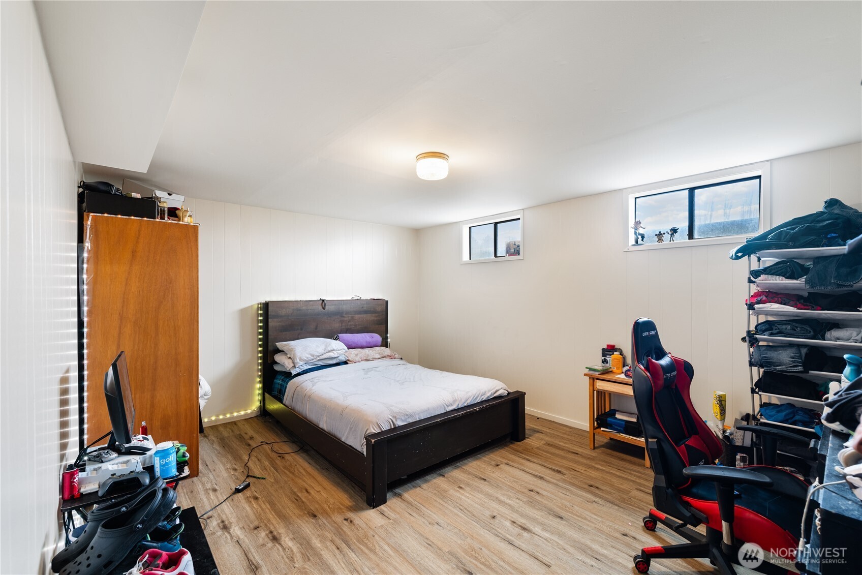 21563-21567 Cook Road Sedro-Woolley, WA 98284 - Photo 21 of 38 a bedroom with a bed and wooden floor