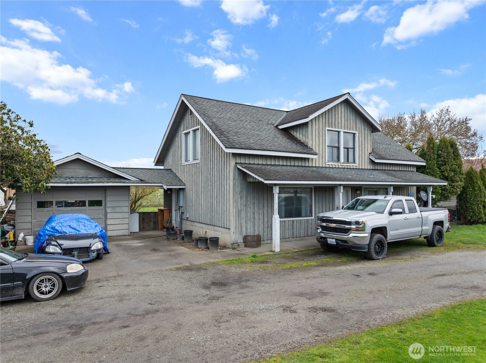 21563-21567 Cook Road Sedro-Woolley, WA 98284 - Photo 4 of 38 a front view of a house with parking space