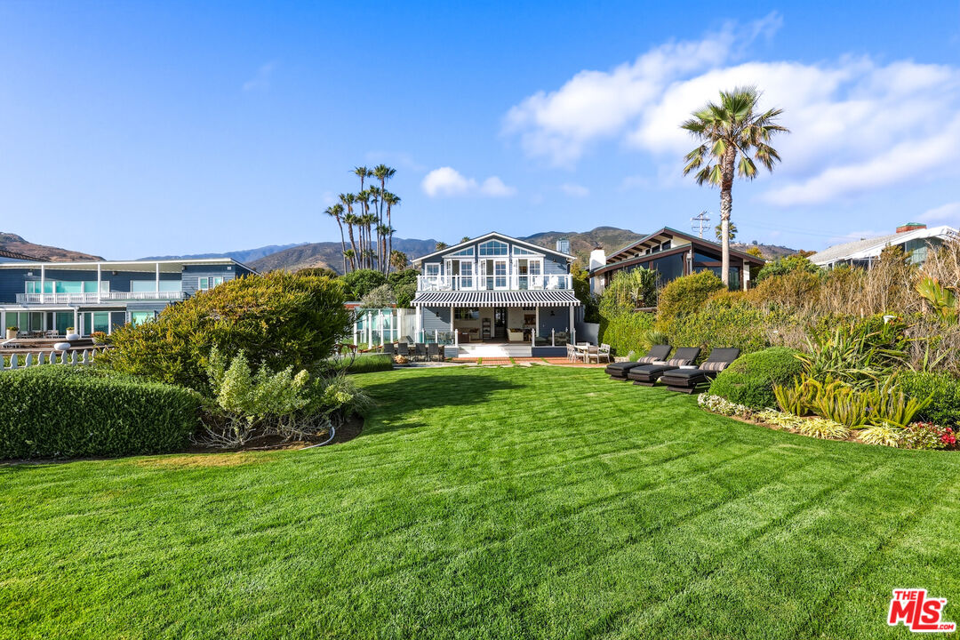 30810 Broad Beach Road Malibu, CA 90265 - Photo 3 of 55 a front view of a house with a garden