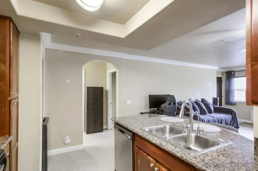 1434 Marshall Road, Unit 28 Alpine, CA 91901 - Photo 21 of 40 a bathroom with a granite countertop sink and a mirror
